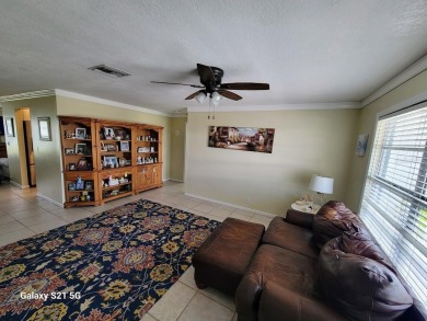 Welcome to Mainlands, an active 55+ golf cart-friendly community on Mainlands Golf Club in Florida - for sale on GolfHomes.com, golf home, golf lot