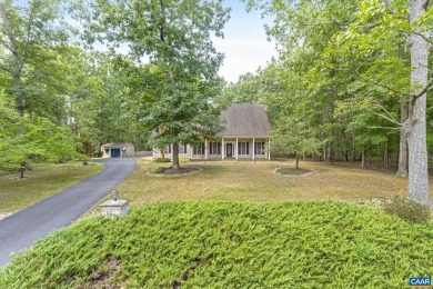 Nestled on a serene half-acre flat lot that backs to peaceful on Lake Monticello Golf Course in Virginia - for sale on GolfHomes.com, golf home, golf lot