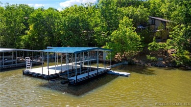 This magnificent 5-bedroom, 3-bathroom lakefront home is walking on The Oaks Golf Course in Missouri - for sale on GolfHomes.com, golf home, golf lot