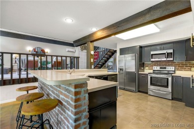 This magnificent 5-bedroom, 3-bathroom lakefront home is walking on The Oaks Golf Course in Missouri - for sale on GolfHomes.com, golf home, golf lot