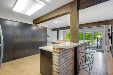This magnificent 5-bedroom, 3-bathroom lakefront home is walking on The Oaks Golf Course in Missouri - for sale on GolfHomes.com, golf home, golf lot