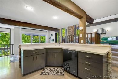This magnificent 5-bedroom, 3-bathroom lakefront home is walking on The Oaks Golf Course in Missouri - for sale on GolfHomes.com, golf home, golf lot