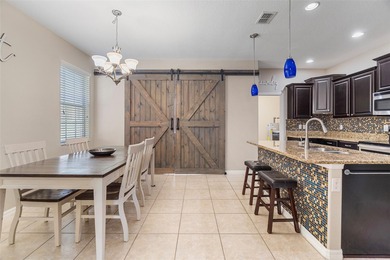 Welcome to this charming 3-bedroom, 2.5-bath home located in the on Harmony Golf Preserve in Florida - for sale on GolfHomes.com, golf home, golf lot