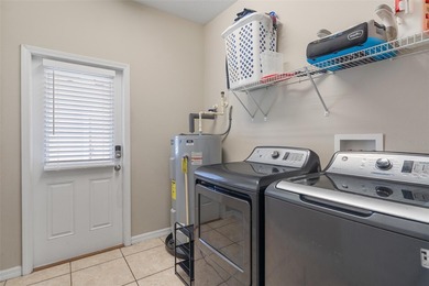 Welcome to this charming 3-bedroom, 2.5-bath home located in the on Harmony Golf Preserve in Florida - for sale on GolfHomes.com, golf home, golf lot