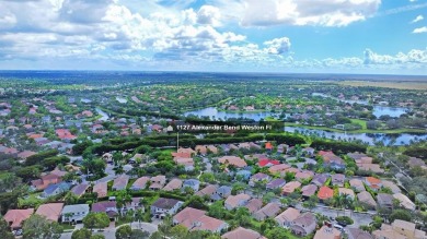 Discover the perfect combination of comfort, style, and on Weston Hills Country Club in Florida - for sale on GolfHomes.com, golf home, golf lot