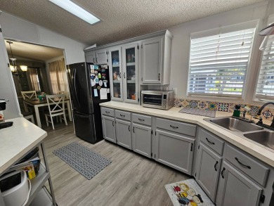 Located in Cypress Lakes Village in a 55+ resort style MH on Big Cypress Golf and Country Club in Florida - for sale on GolfHomes.com, golf home, golf lot
