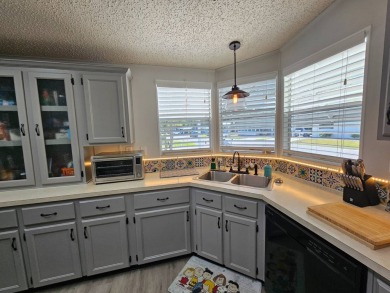 Located in Cypress Lakes Village in a 55+ resort style MH on Big Cypress Golf and Country Club in Florida - for sale on GolfHomes.com, golf home, golf lot