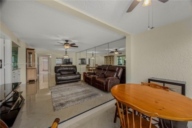 Welcome to 1911 Sabal Palm Dr #105--your serene escape with on Pine Island Ridge Country Club in Florida - for sale on GolfHomes.com, golf home, golf lot