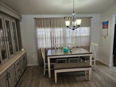 Located in Cypress Lakes Village in a 55+ resort style MH on Big Cypress Golf and Country Club in Florida - for sale on GolfHomes.com, golf home, golf lot