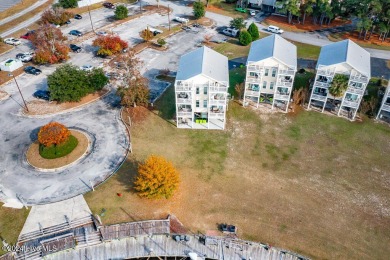 STUNNING LOCATION! Beautiful townhouse overlooking the Northwest on Harbour Point Golf Club in North Carolina - for sale on GolfHomes.com, golf home, golf lot