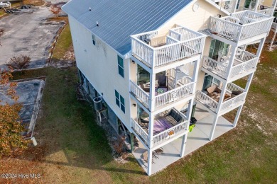 STUNNING LOCATION! Beautiful townhouse overlooking the Northwest on Harbour Point Golf Club in North Carolina - for sale on GolfHomes.com, golf home, golf lot