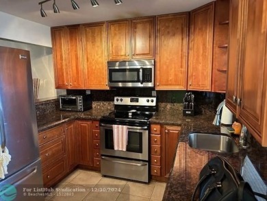 Beautiful water view updated 1 bedroom, 1  1/2  bath condo on Sunrise Lakes Phase III in Florida - for sale on GolfHomes.com, golf home, golf lot