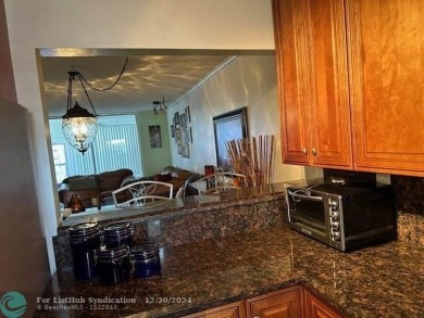 Beautiful water view updated 1 bedroom, 1  1/2  bath condo on Sunrise Lakes Phase III in Florida - for sale on GolfHomes.com, golf home, golf lot