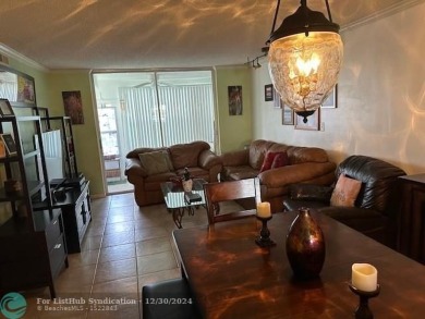 Beautiful water view updated 1 bedroom, 1  1/2  bath condo on Sunrise Lakes Phase III in Florida - for sale on GolfHomes.com, golf home, golf lot