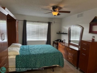 Beautiful water view updated 1 bedroom, 1  1/2  bath condo on Sunrise Lakes Phase III in Florida - for sale on GolfHomes.com, golf home, golf lot