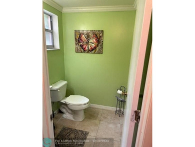 Beautiful water view updated 1 bedroom, 1  1/2  bath condo on Sunrise Lakes Phase III in Florida - for sale on GolfHomes.com, golf home, golf lot