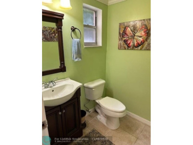 Beautiful water view updated 1 bedroom, 1  1/2  bath condo on Sunrise Lakes Phase III in Florida - for sale on GolfHomes.com, golf home, golf lot
