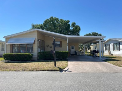 Welcome to this beautifully maintained 2/2 home where you will on Lake Henry Golf Club in Florida - for sale on GolfHomes.com, golf home, golf lot