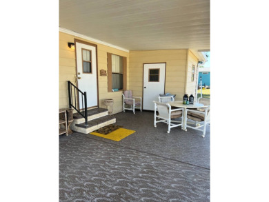 Welcome to this beautifully maintained 2/2 home where you will on Lake Henry Golf Club in Florida - for sale on GolfHomes.com, golf home, golf lot