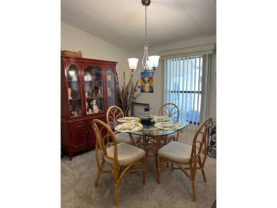 Welcome to this beautifully maintained 2/2 home where you will on Lake Henry Golf Club in Florida - for sale on GolfHomes.com, golf home, golf lot