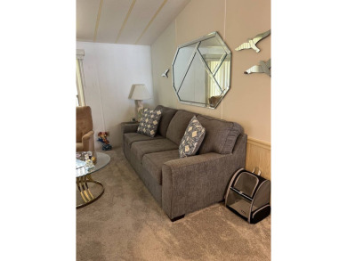 Welcome to this beautifully maintained 2/2 home where you will on Lake Henry Golf Club in Florida - for sale on GolfHomes.com, golf home, golf lot