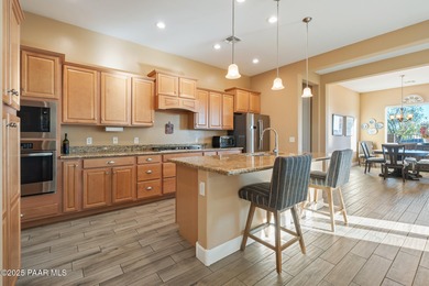 Impressive residence in Quailwood, set on a premium golf course on Quail Wood Greens Golf Course in Arizona - for sale on GolfHomes.com, golf home, golf lot