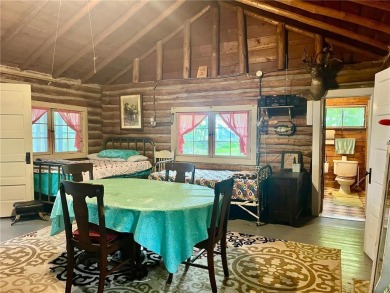 Step back in time with this charming, 100+ year-old seasonal log on Minnesota National Golf Course in Minnesota - for sale on GolfHomes.com, golf home, golf lot