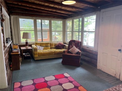 Step back in time with this charming, 100+ year-old seasonal log on Minnesota National Golf Course in Minnesota - for sale on GolfHomes.com, golf home, golf lot