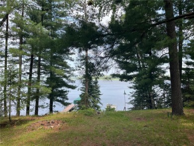 Step back in time with this charming, 100+ year-old seasonal log on Minnesota National Golf Course in Minnesota - for sale on GolfHomes.com, golf home, golf lot