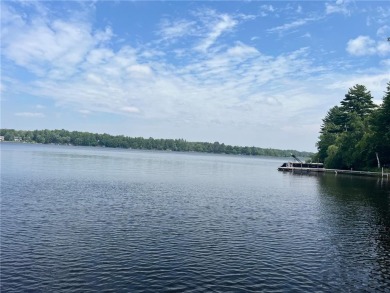 Step back in time with this charming, 100+ year-old seasonal log on Minnesota National Golf Course in Minnesota - for sale on GolfHomes.com, golf home, golf lot