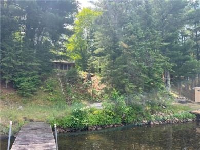Step back in time with this charming, 100+ year-old seasonal log on Minnesota National Golf Course in Minnesota - for sale on GolfHomes.com, golf home, golf lot