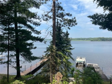 Step back in time with this charming, 100+ year-old seasonal log on Minnesota National Golf Course in Minnesota - for sale on GolfHomes.com, golf home, golf lot