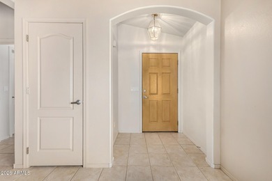 Live on the 18th green of Coyote Lakes in this bright, inviting on Coyote Lakes Golf Club in Arizona - for sale on GolfHomes.com, golf home, golf lot