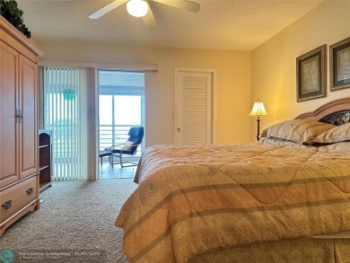 WATER VIEW! Indulge in this luxury 2 bed, 2 bath condo nestled on Hillsboro Pines Golf in Florida - for sale on GolfHomes.com, golf home, golf lot