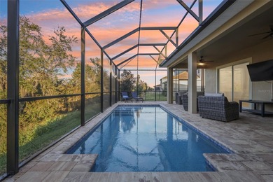 Perfectly positioned on a premium conservation homesite with on ChampionsGate Golf Resort in Florida - for sale on GolfHomes.com, golf home, golf lot