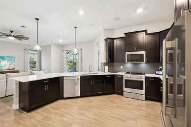 Perfectly positioned on a premium conservation homesite with on ChampionsGate Golf Resort in Florida - for sale on GolfHomes.com, golf home, golf lot