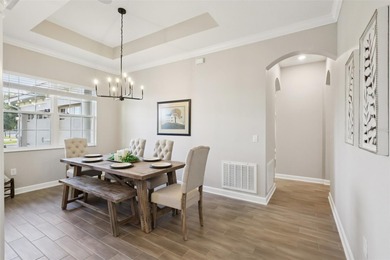 Perfectly positioned on a premium conservation homesite with on ChampionsGate Golf Resort in Florida - for sale on GolfHomes.com, golf home, golf lot