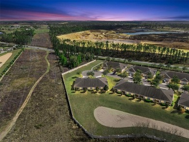 Welcome home to this charming VILLA in the highly sought-after on Kings Ridge Golf Club in Florida - for sale on GolfHomes.com, golf home, golf lot