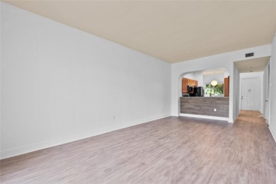 Step into style with this charming 2-bedroom, 2-bathroom unit on Palm-Aire Country Club and Resort - The Oaks in Florida - for sale on GolfHomes.com, golf home, golf lot