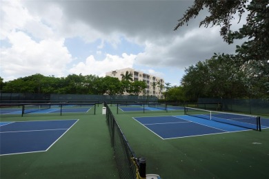 Step into style with this charming 2-bedroom, 2-bathroom unit on Palm-Aire Country Club and Resort - The Oaks in Florida - for sale on GolfHomes.com, golf home, golf lot