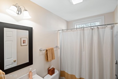 This charming 4-bedroom, 3-bath home offers a perfect blend of on Members Club At St. James Plantation in North Carolina - for sale on GolfHomes.com, golf home, golf lot