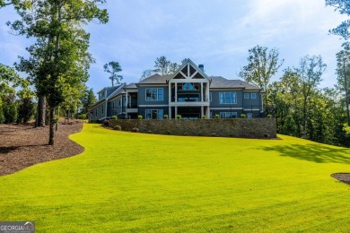 Experience unparalleled luxury and serene lake living in this on Reynolds Lake Oconee - The Oconee in Georgia - for sale on GolfHomes.com, golf home, golf lot