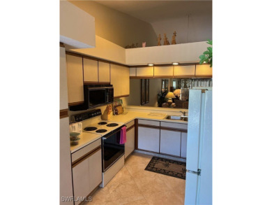Second floor unit with vaulted ceiling in desirable Clubhouse on Cross Creek Country Club in Florida - for sale on GolfHomes.com, golf home, golf lot