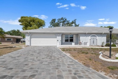 Nestled on a serene cul-de-sac with picturesque lake views, this on Caloosa Greens Executive Golf Course in Florida - for sale on GolfHomes.com, golf home, golf lot