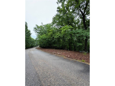 Gentle sloping lot nestled in a quiet cul-de-sac on Via Bello on The Club At Porto Cima in Missouri - for sale on GolfHomes.com, golf home, golf lot