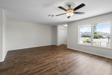 Nestled on a serene cul-de-sac with picturesque lake views, this on Caloosa Greens Executive Golf Course in Florida - for sale on GolfHomes.com, golf home, golf lot