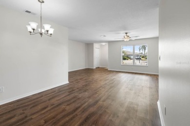 Nestled on a serene cul-de-sac with picturesque lake views, this on Caloosa Greens Executive Golf Course in Florida - for sale on GolfHomes.com, golf home, golf lot
