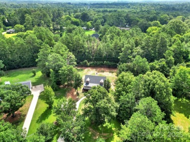 Welcome to this stunning 3-bedroom, 2-bathroom home nestled on on Rock Hill Country Club in South Carolina - for sale on GolfHomes.com, golf home, golf lot