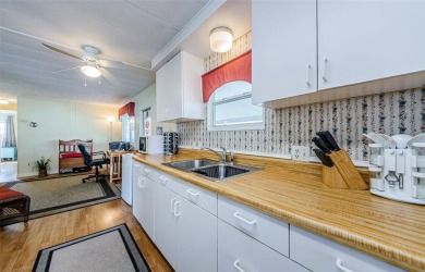 Located in the highly desirable STONEHEDGE ON THE HILL 55+ on Tarpon Springs Golf Course in Florida - for sale on GolfHomes.com, golf home, golf lot