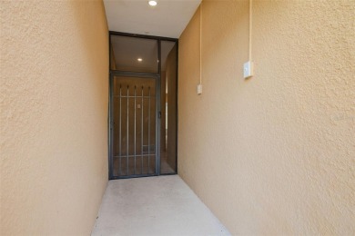 This tastefully done resort style townhome in a gated community on Gulf Harbors Golf Course in Florida - for sale on GolfHomes.com, golf home, golf lot